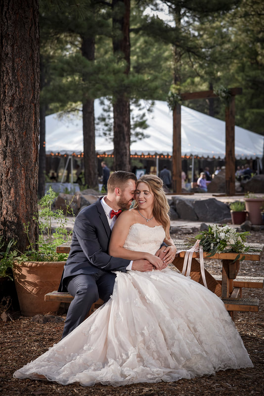 flagstaff arboretum wedding couple kissing outdoor ceremony reception
