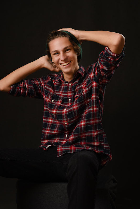 flagstaff photo studio high school senior boy casual laughing fun plaid shirt